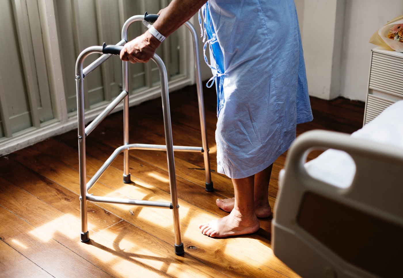 Patient using walking frame