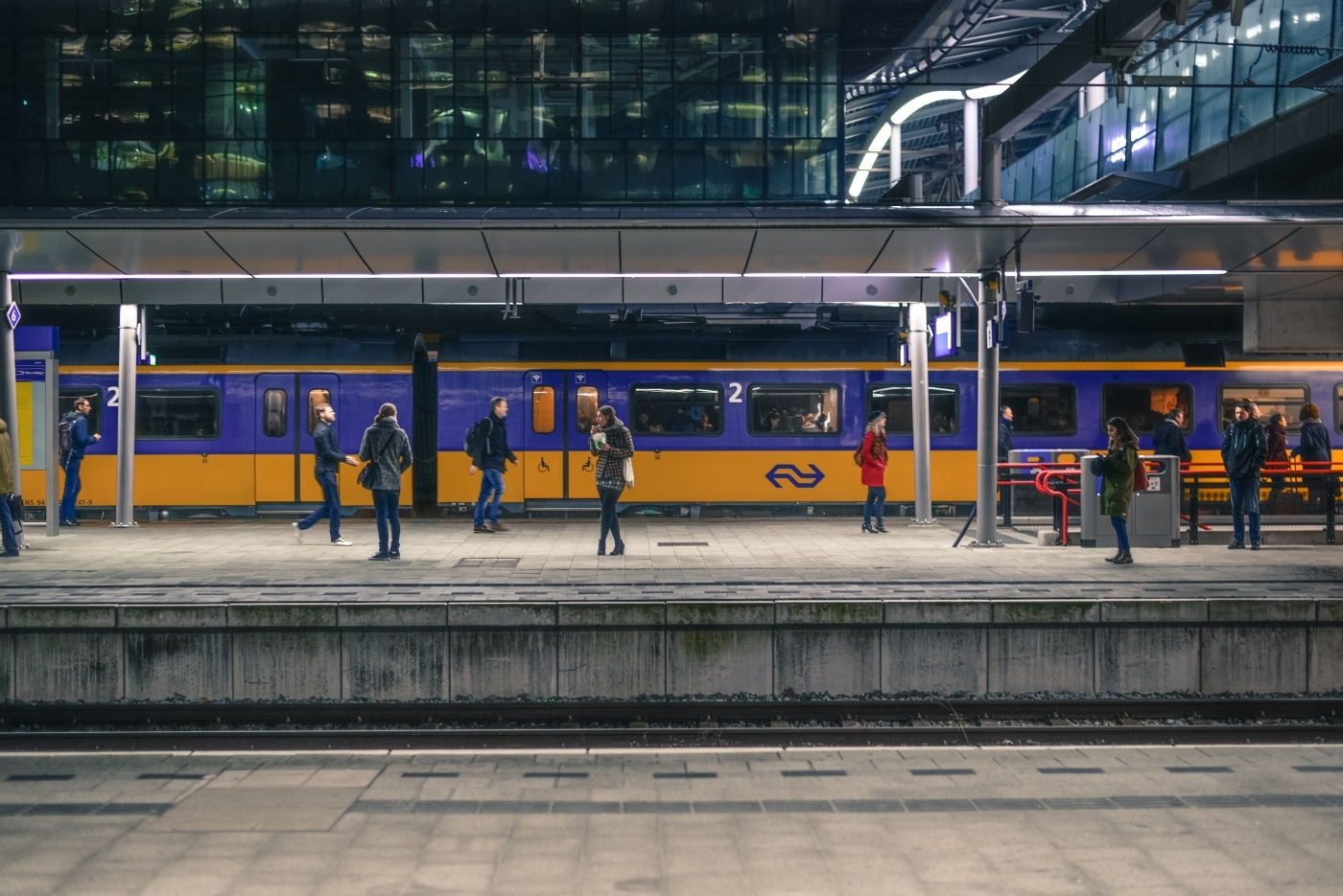 Passengers walking on train platform